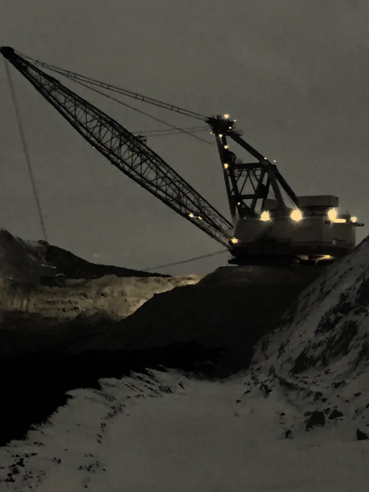 A dragline working a coal mine at dusk
