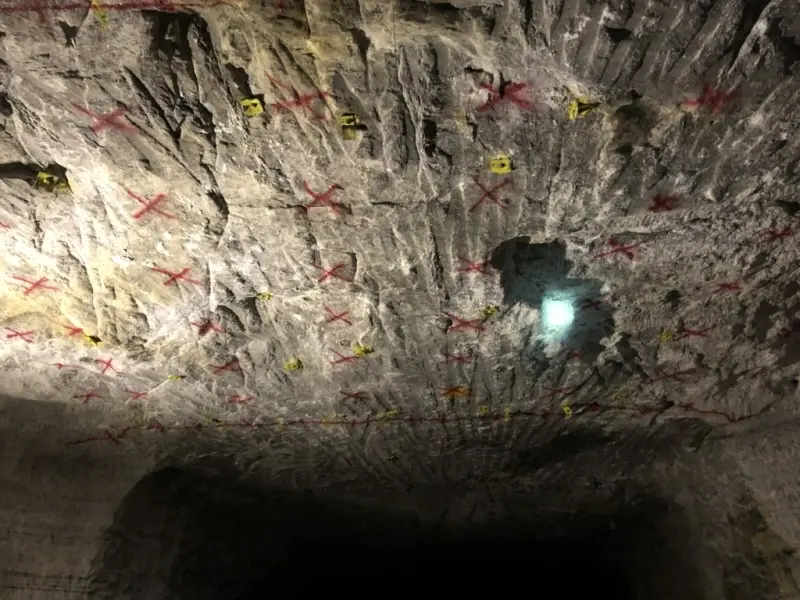 Rock underground, marked up in paint before the next round