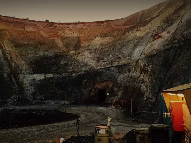 A portal at the bottom of an open pit, where the decline goes underground