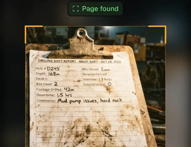 Big Dog OS on a phone camera: a muddy handwritten drilling shift report on a clipboard, page found